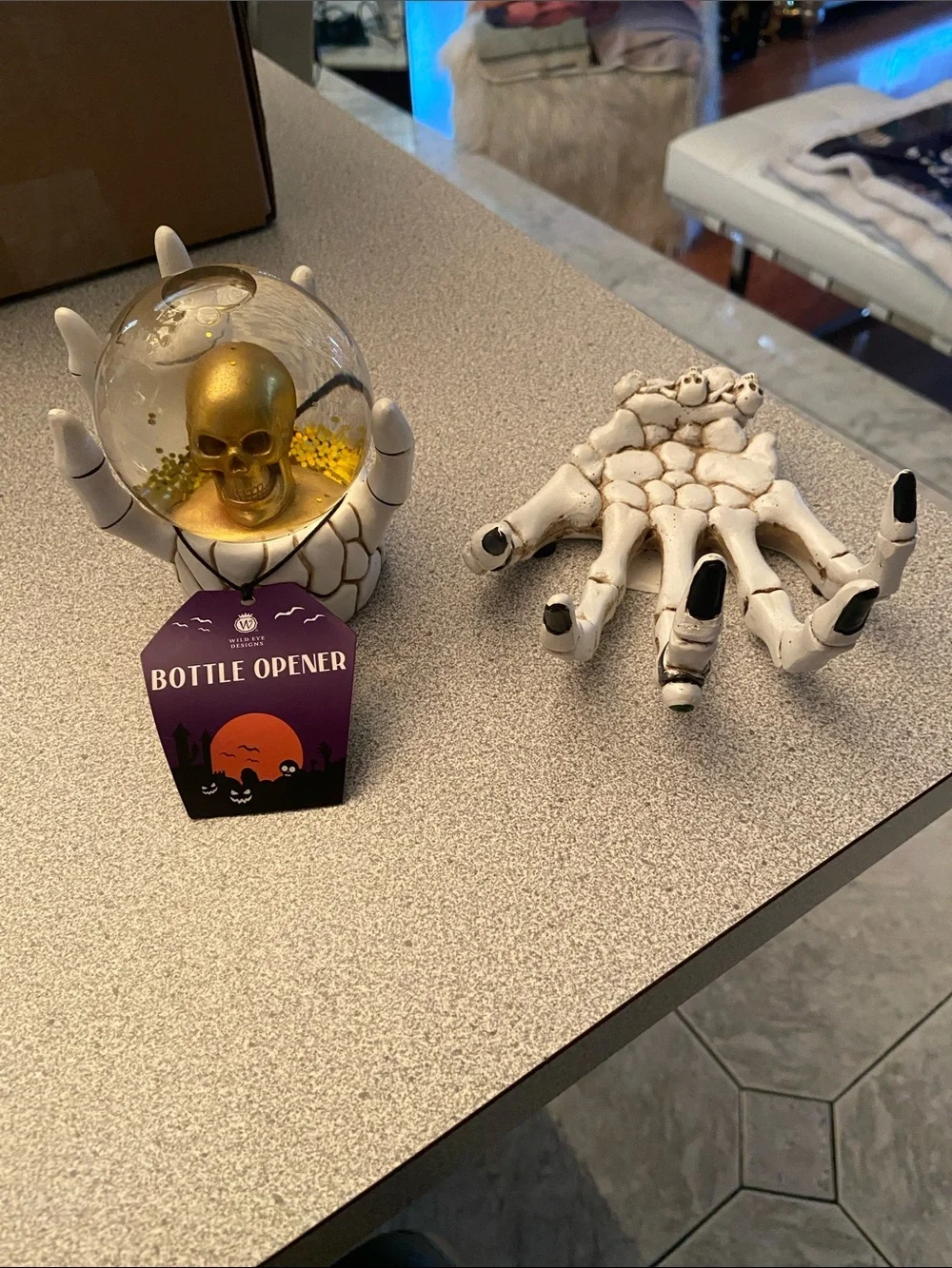 Williams Sonoma Gold Skull Snow Globe and White Skeleton Hand Bottle Opener